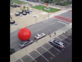 Giant red ball from an art installation broke free in toledo