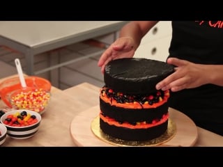 How to make a black cobweb cake! chocolate cake, black ganache and filled with halloween candy!