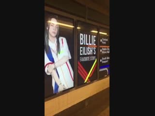 Billie spotted on train station platform billboards