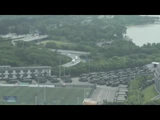 Afptv exclusive video has captured images of thousands of chinese military personnel parading at a sports stadium across the bo