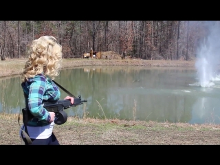 Blonde girl shoots machinegun