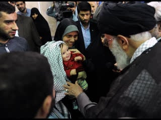 Ayatollah khamenei presented his keffiyeh to a disabled veteran's grandchild