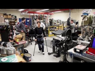 Persons with spinal cord injury playing soccer while wearing berkeley exoskeleton