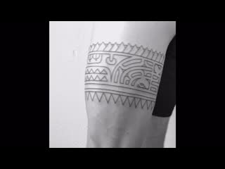 Polynesian tattoo bandage on the leg