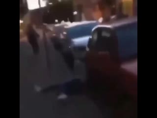 A black man punches a blonde woman in the face