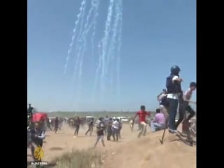 Israeli drone targeting civilians and journalist with tear gas