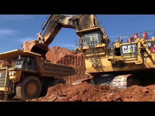 440 tonnes cat 6040 excavator loading dumpers and operator view