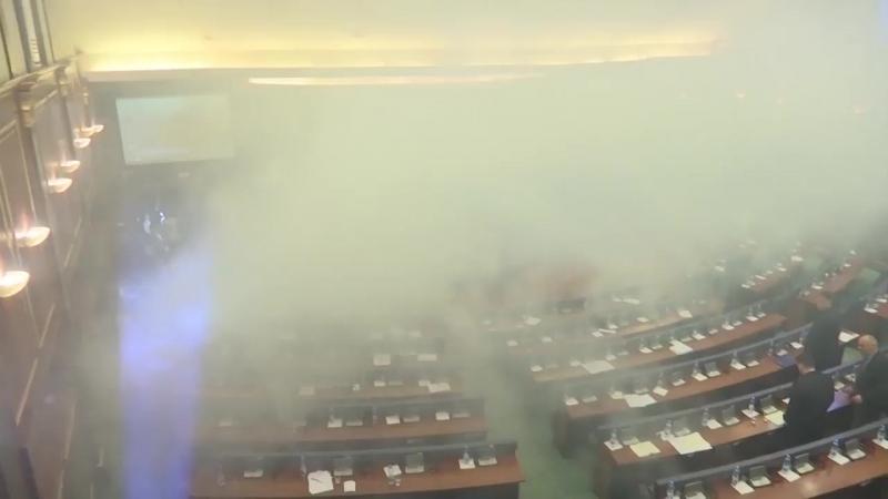 Opposition mps in kosovo release tear gas into parliament to prevent a vote