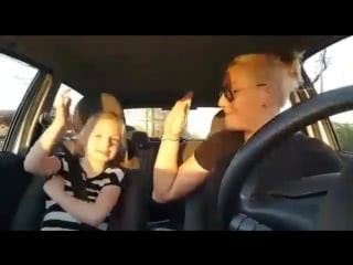 Mother and daughter both loving hardstyle in the car