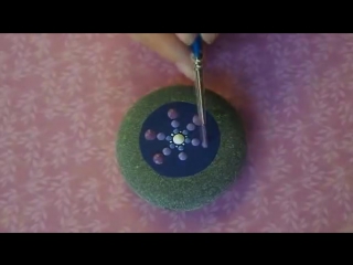 Elspeth mclean painting a jewel drop mandala stone