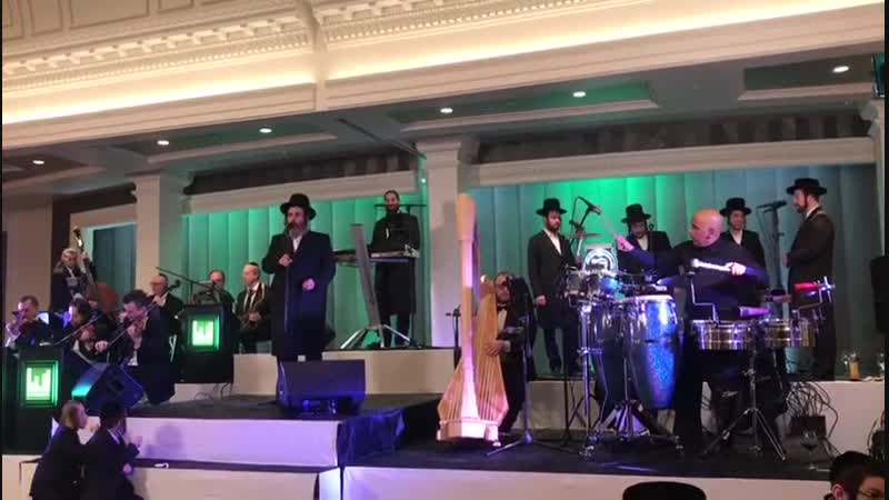 Shimmy levy and issac honig with the shira choir singing at the first event by the new krasna hl