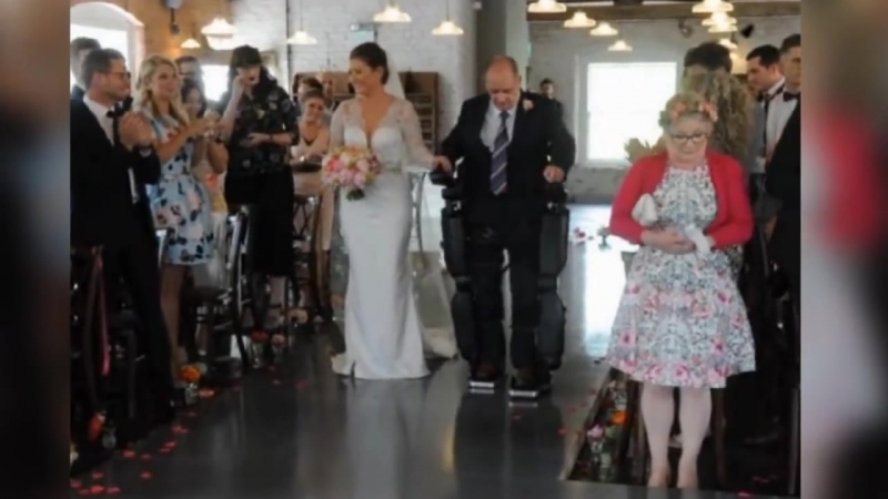Paralysed dad walks daughter down aisle on wedding day in derby