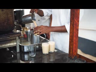 Pouring Chai Tea Into Cups In Kerala India
