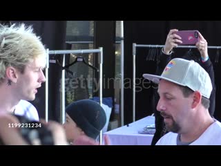 Machine gun kelly & adam sandler at the california strong celebrity softball game at pepperdine university in malibu