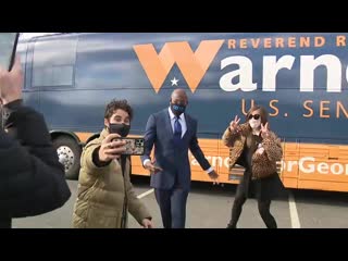 Georgia @darrencriss grabs a selfie with @reverendwarnock in marietta, georgia