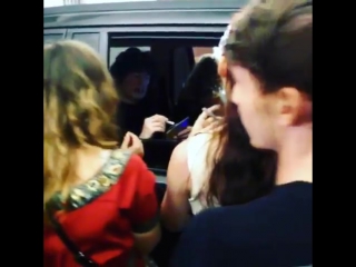 Signing stuff for the fans by octavio and laura