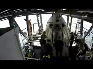 Scorch marks are seen on the outside of the spacex dragon endeavour as we prepare to open the hatch
