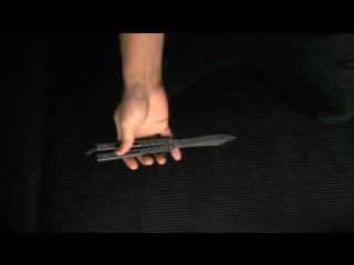 Reverse behind the eight ball super slow mo (balisong trick)