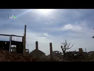 Doesn’t even flinch while filming “barrel bombs” close by