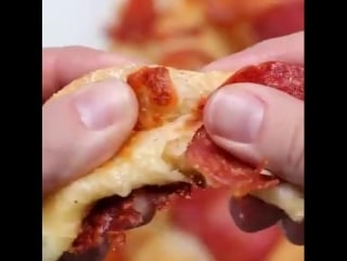 Pizza pretzels with cheese and sausages