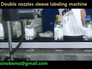 Double nozzles sleeve labeling machine