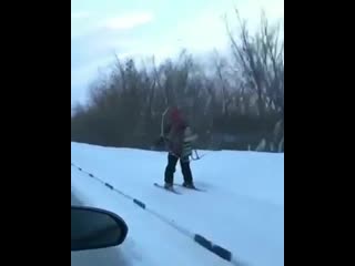 Just a man skiing with a propeller