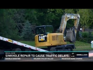 Crews repairing sinkhole that swallowed car in boulder