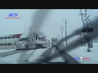 A train hits a moving fedex truck sending contents flying