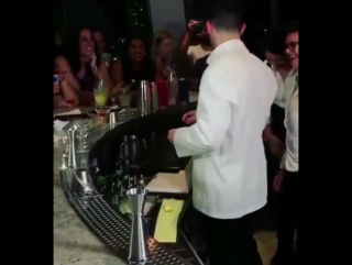 Nick jonas making drinks/behind the bar on november 17th 2017 at > in nassau, bahamas