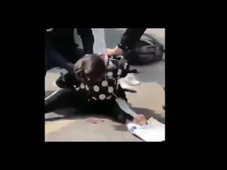 Woman in china resisting as police forces her to be quarantine for wuhan corona virus coronavirus wuhan china