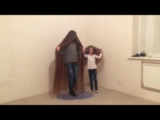 Real life rapunzel teaches her god daughter long hair modeling