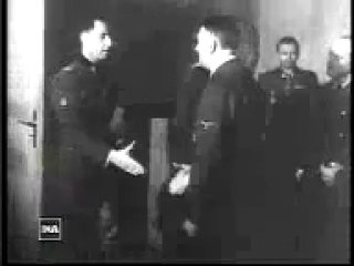 Leon degrelle being decorated by adolf hitler