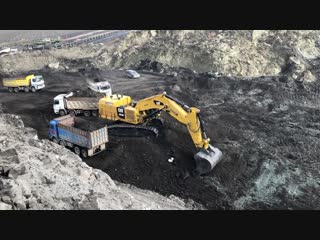 Cat 6015b excavator loading trucks with two passes sotiriadis brothers