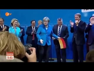 Angela merkel visibly disgusted by german flag throws it away during celebration