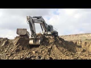 Liebherr 984 excavator loading trucks