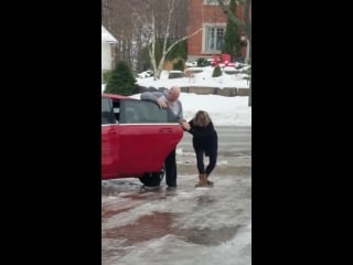 This woman trying to get in her car while slipping on ice is amazing that laugh