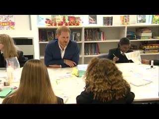 Prince harry shares a joke with shy student at nottingham academy