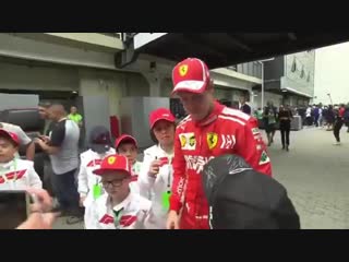 Vettel taking off a mercedes cap on a porn, replaces it with a ferrari cap