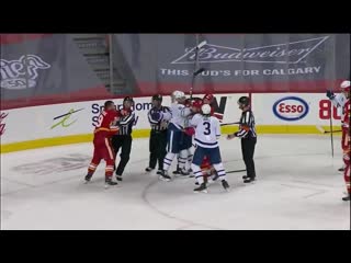 Jake muzzin flips puck at matthew tkachuk after final horn causing scrum between leafs flames