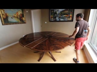 Expanding circular dining table in walnut