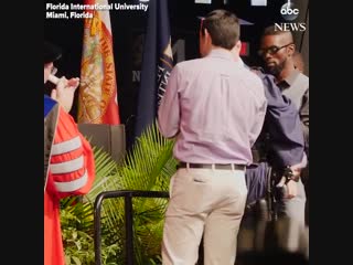 A quadriplegic student used a robotic exoskeleton to walk across stage and receive his diploma