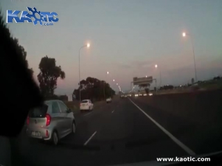 Man in a convertible ejected into the air when he hits the central barrier