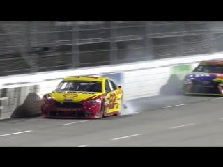 Logano spins after contact with kyle busch