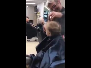 Guys in a barbershop in italy sing to a little boy tp ease his first time shaving his head